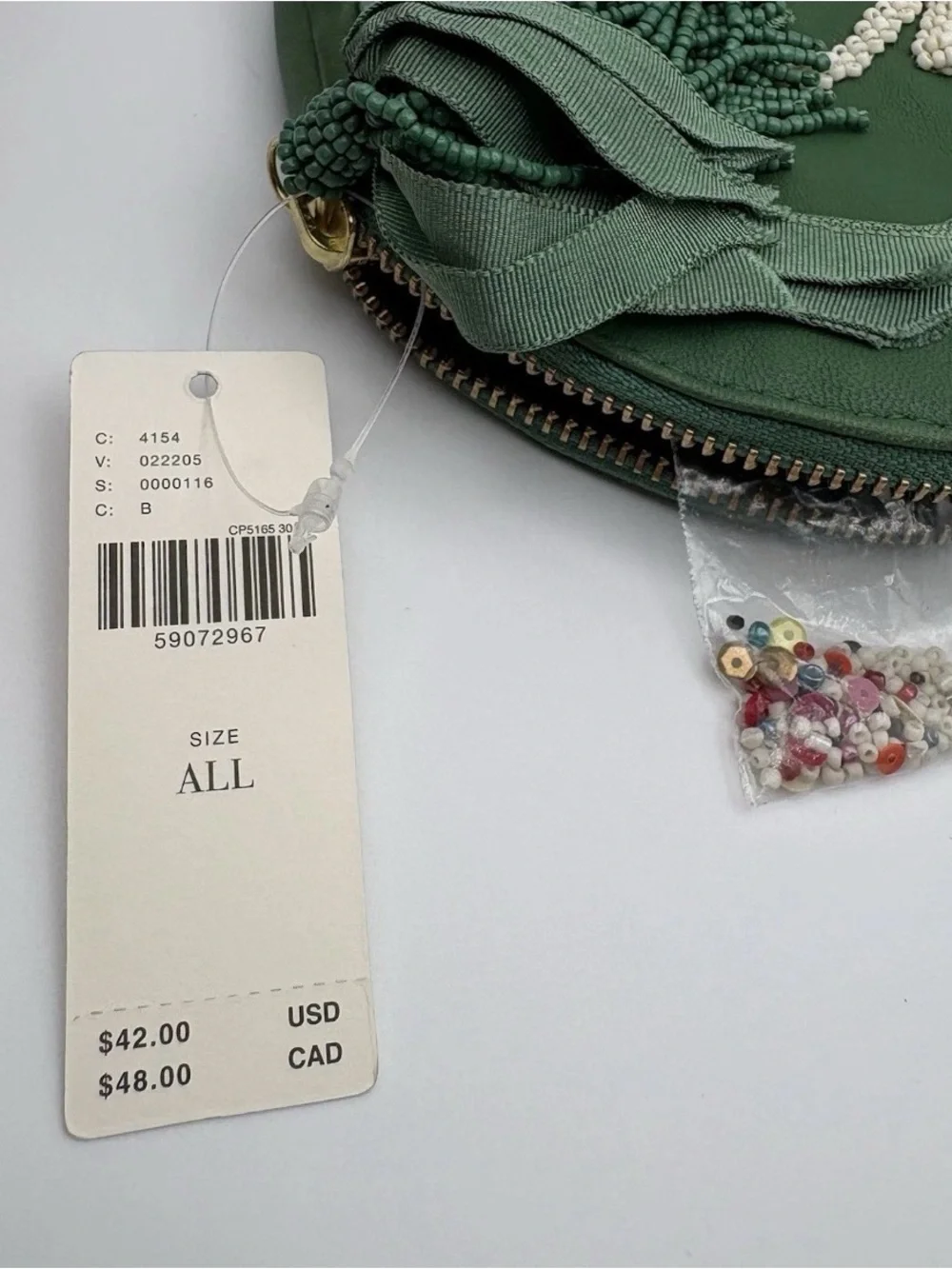 Anthropologie Green Round Embellished Wristlet with Floral Appliqué